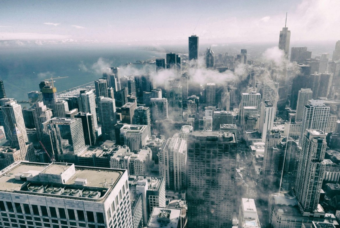 Stunning aerial perspective of Chicago's skyline with clouds, showcasing urban architecture.